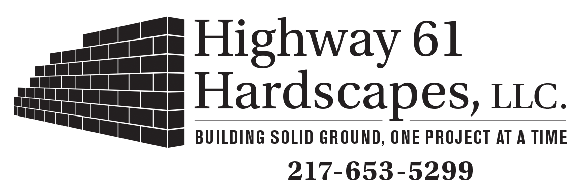 Highway 61 Hardscapes logo with brick wall and contact number