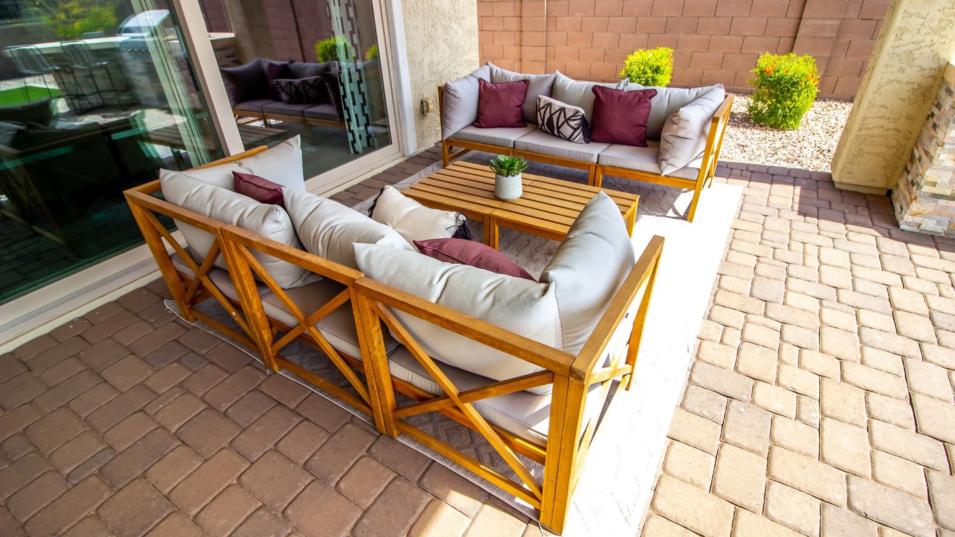 Modern wooden outdoor patio furniture with gray and burgundy cushions