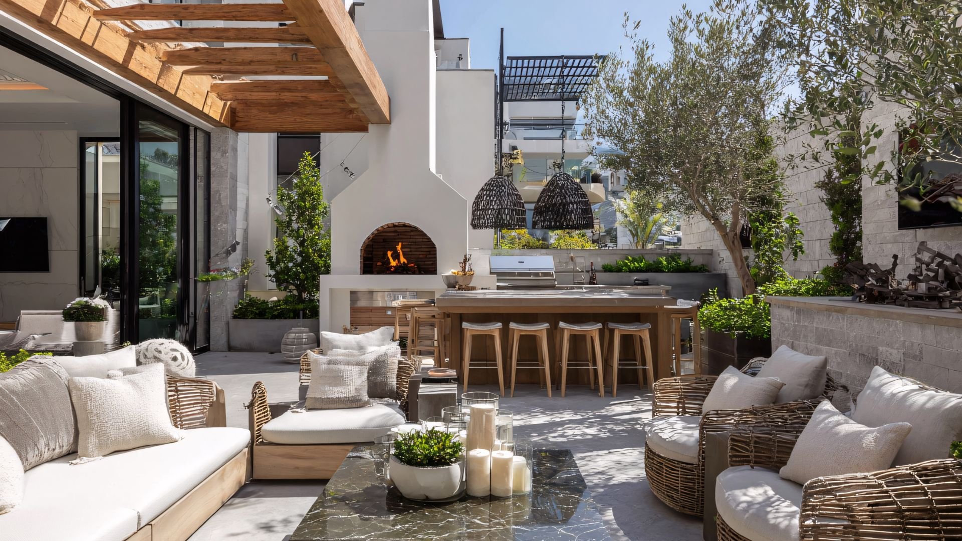 Modern outdoor kitchen with fireplace, seating area, and wooden design